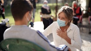 ECW Director Yasmine Sherif with a child in Lebanon