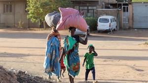 Family walking in Sudan
