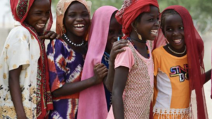 Girls outside a school laughing