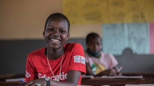 A child in a classroom in Uganda.