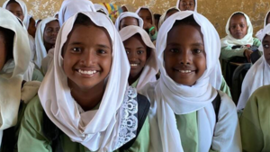 Girls smile at school.