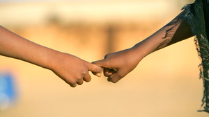 Children holding hands.