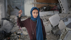 Girl from Gaza in a destroyed school.
