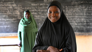 Girl and a teacher in class