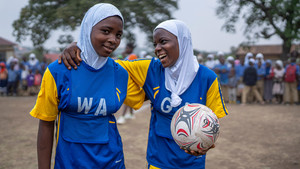 Girls playing football