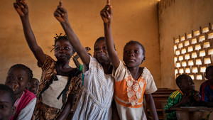 Children raising their hand in a classroom in CAR
