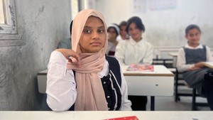 Young girl in class in Iraq.