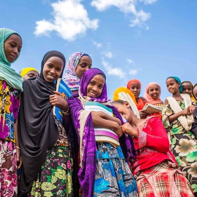 Group of girls holding books