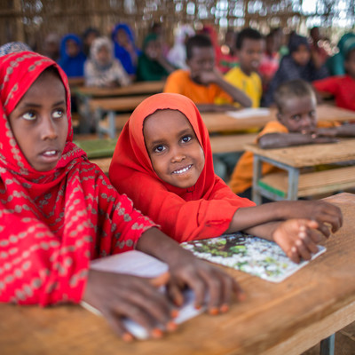 Two girls attending class
