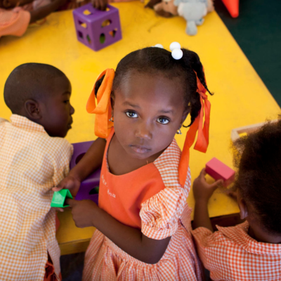 Young girl in Haiti draws.