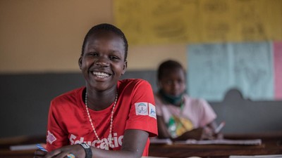 A child in a classroom in Uganda.