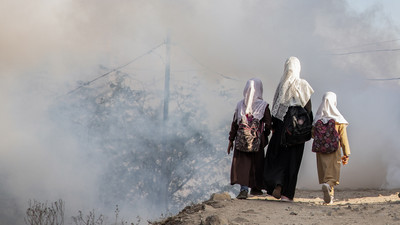 Girls walk to school in Yemen.