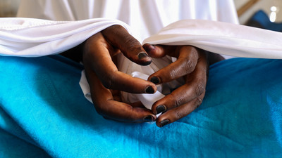 A close-up of the hands of a girl in Nigeria.