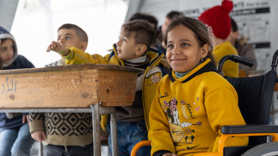 Girl in class in Syria.