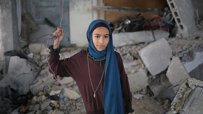 Girl from Gaza in a destroyed school.