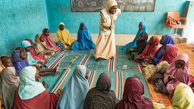 Lady teaching young girls