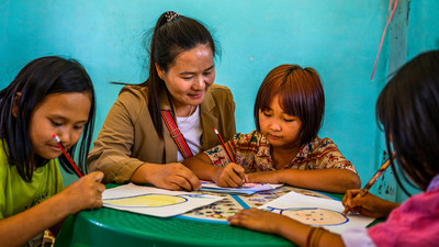 Girls and teacher in an education setting