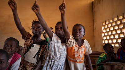 Children raising their hand in a classroom in CAR