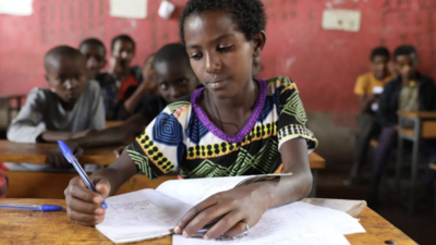 Girl works on an assignment in class in Ethiopia.