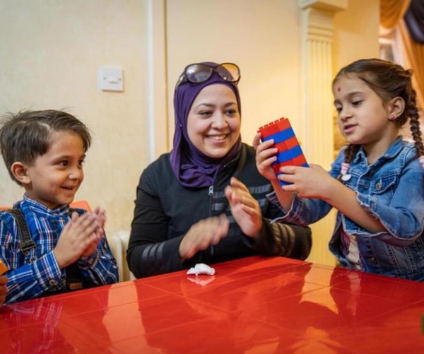 Young girl and boy in Jordan play with legos.