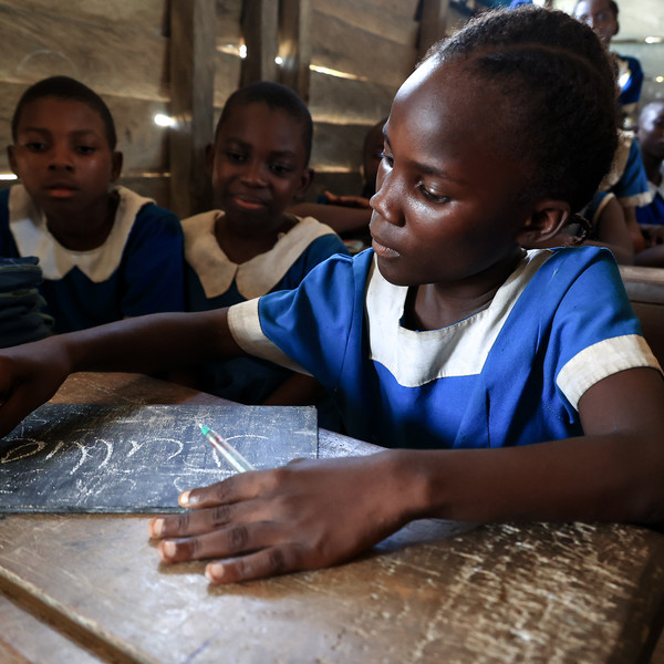 Girl writing in Cameroon.