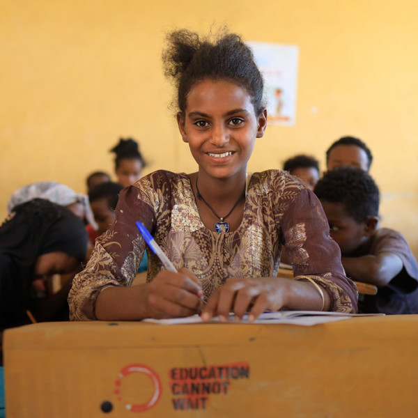 Girl attending class sitting in a desk