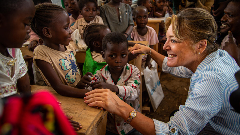 ECW Director Yasmine Sherif interacts with children in DRC
