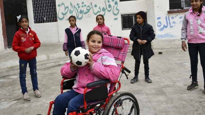 Girl playing with a soccer ball