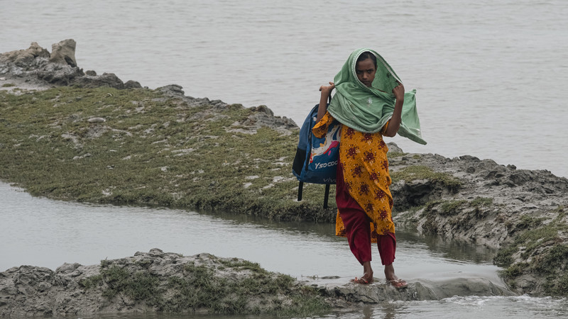 Girl holding a schoolbag