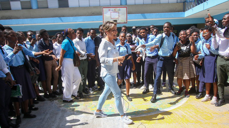 Yasmine Sherif with children at a school in Haiti