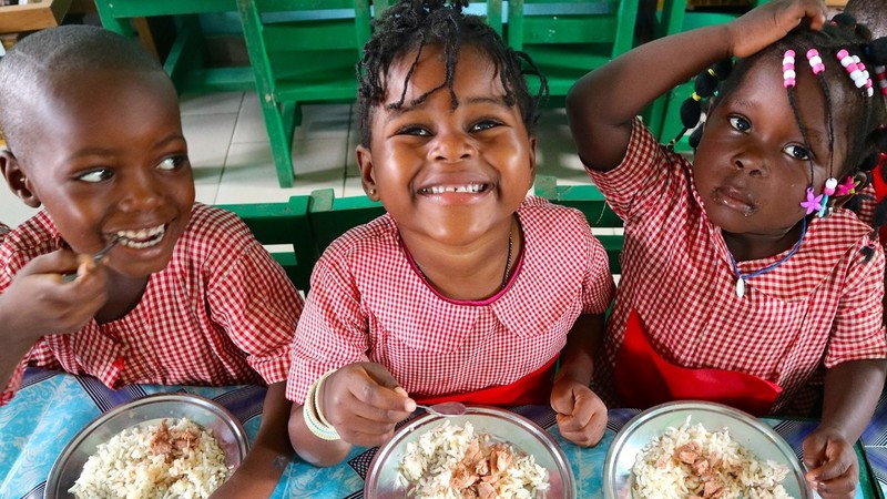 Girls having school meals