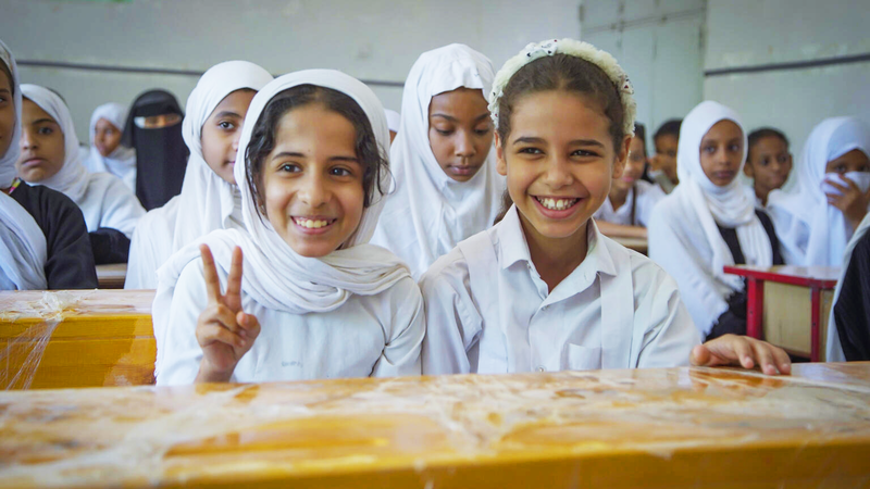 girls smiling during class