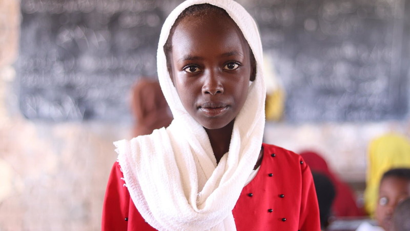 Sudanese girl attending class