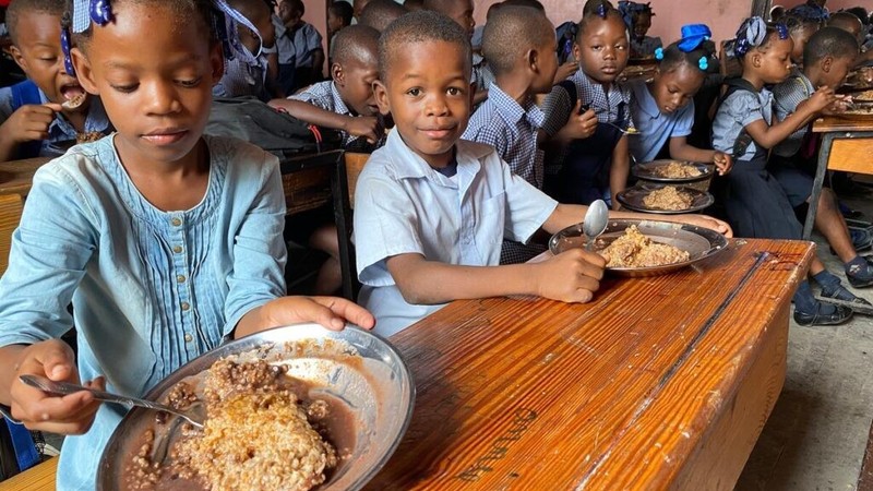 Group of children having a meal