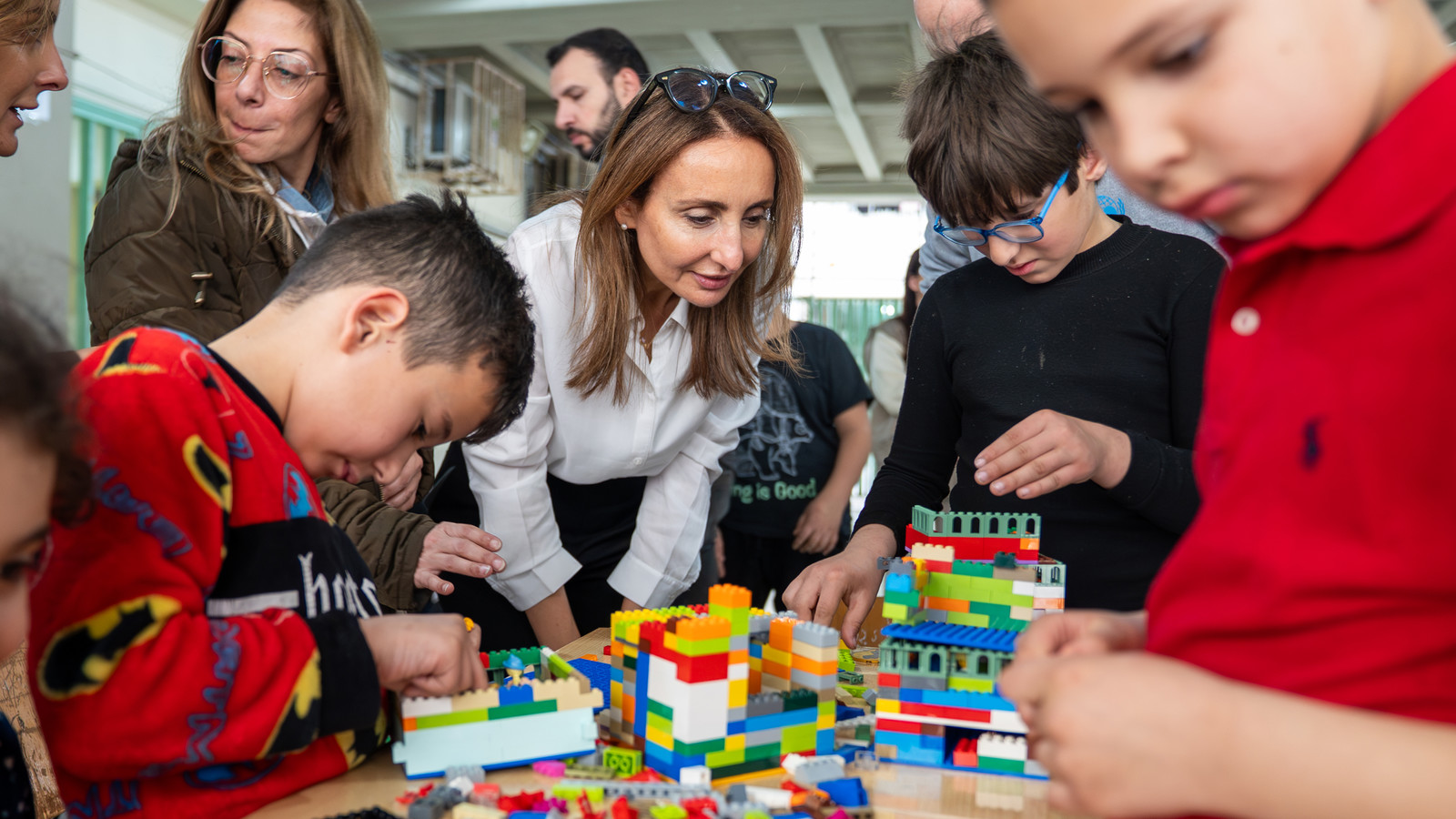 ECW Director Maysa Jalbout interacts with children in a shelter in Lebanon