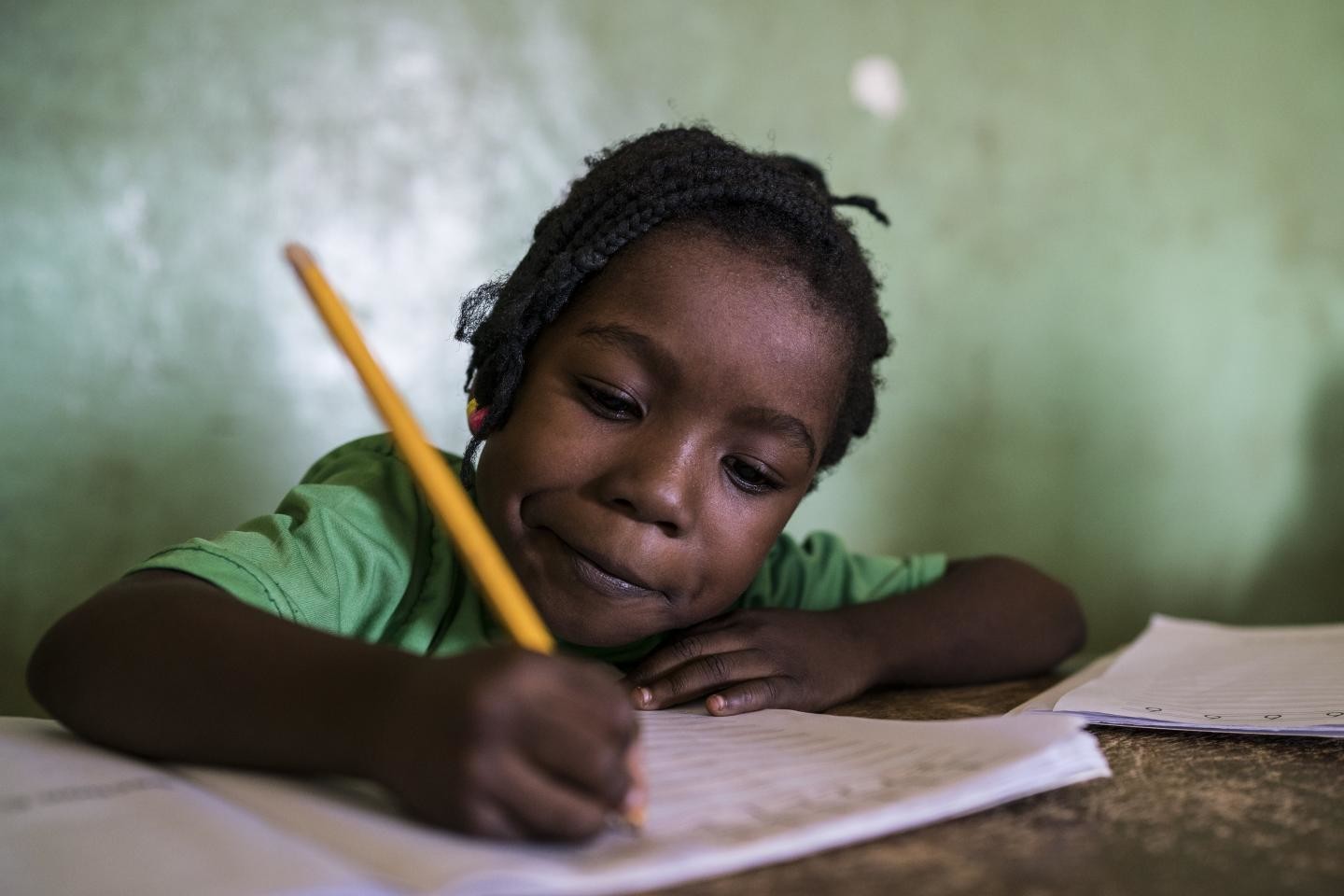 Girl writing on her notebook