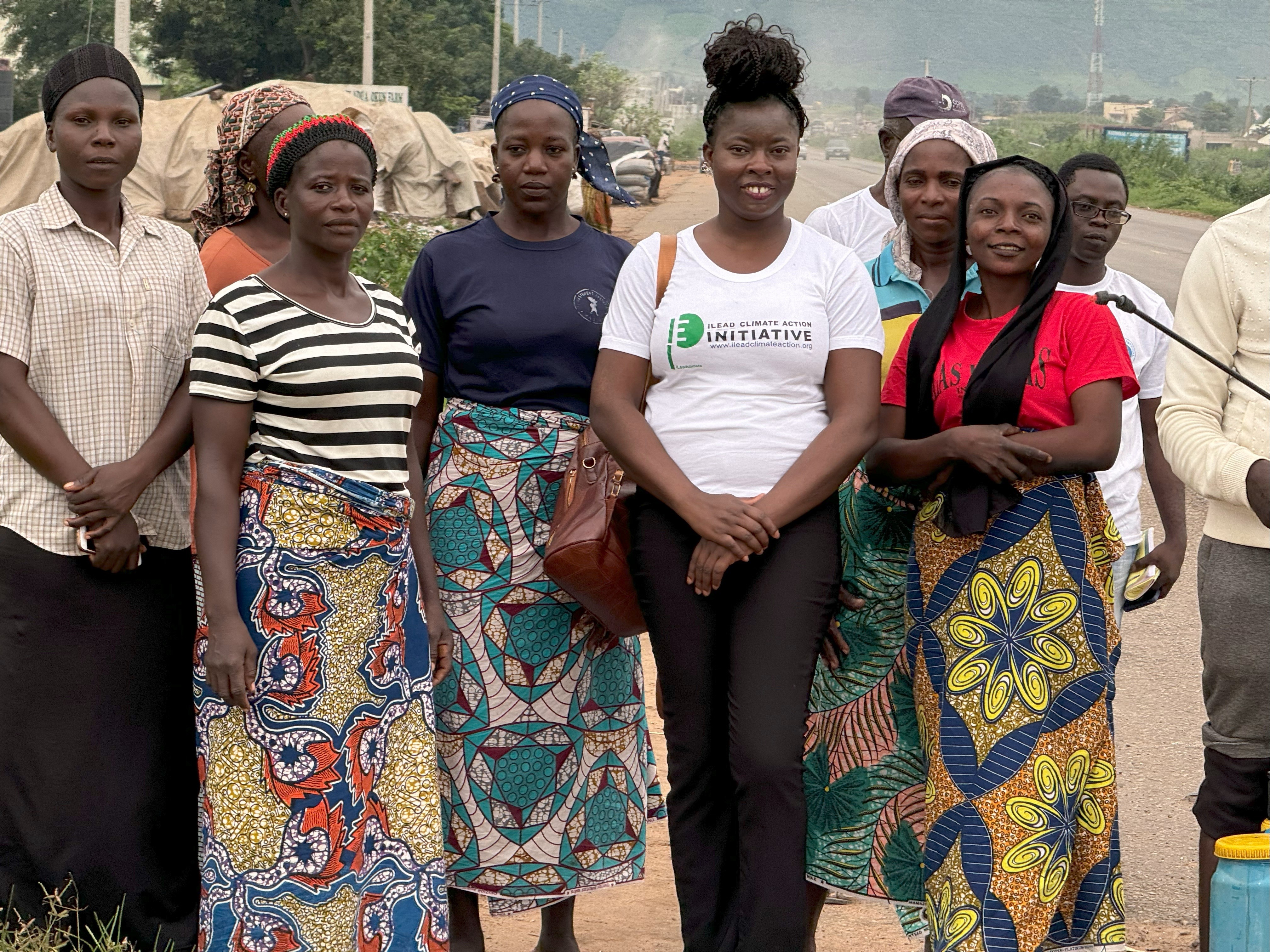 Adenike picture in the field with local women