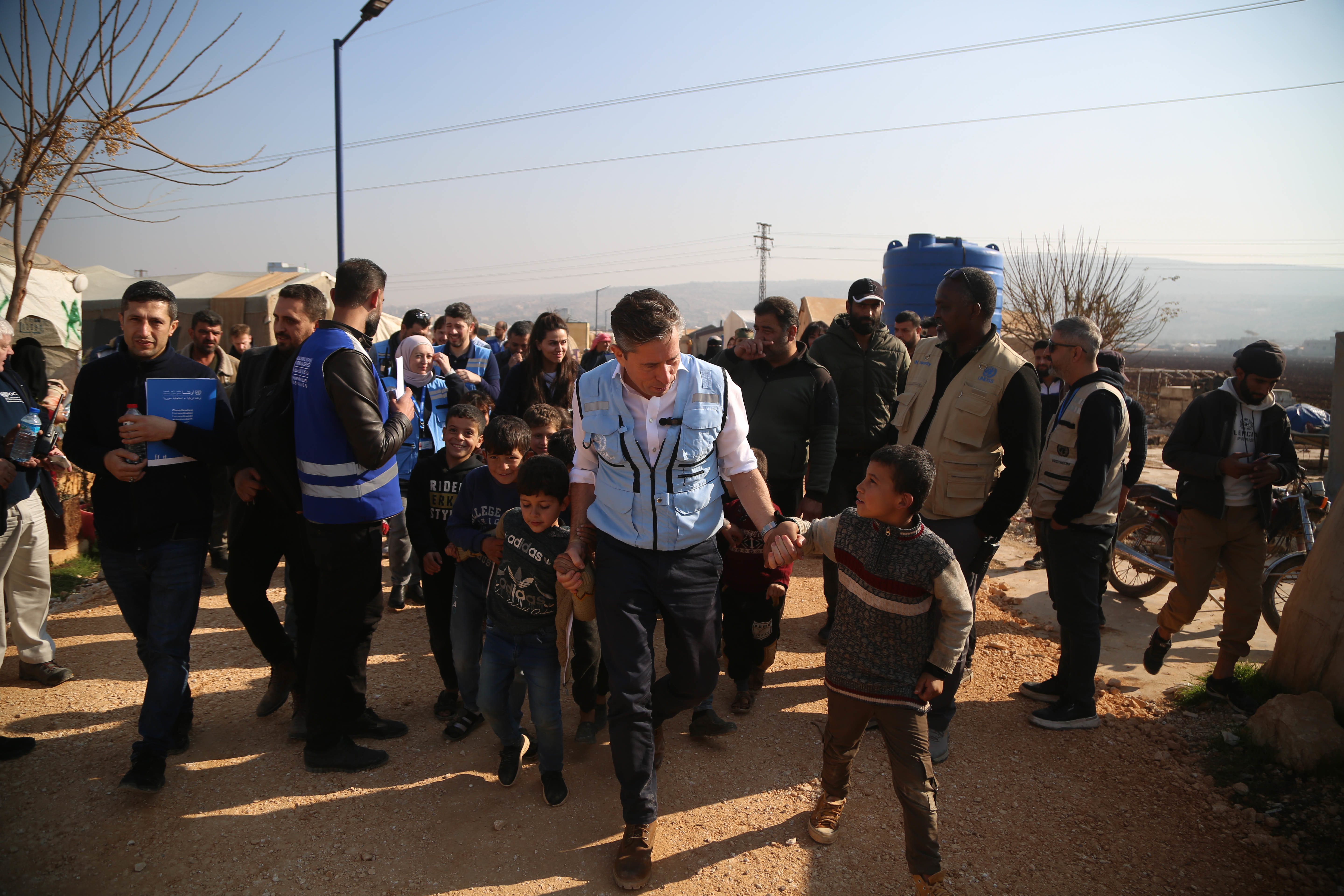 Tom Fletcher interacting with children in the field
