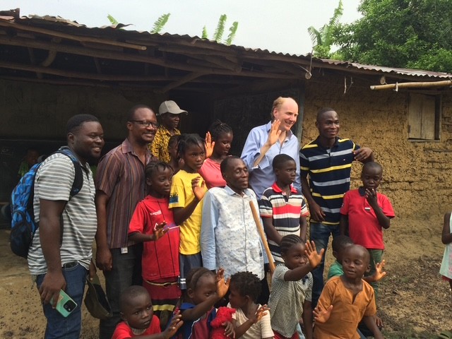 Tom Dannatt and children posing for a photo