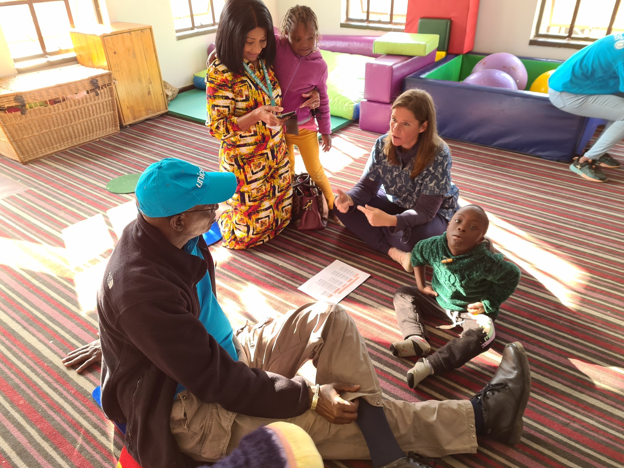 Mohamed M. Malick Fall interacting with children and personnel inside a learning facility