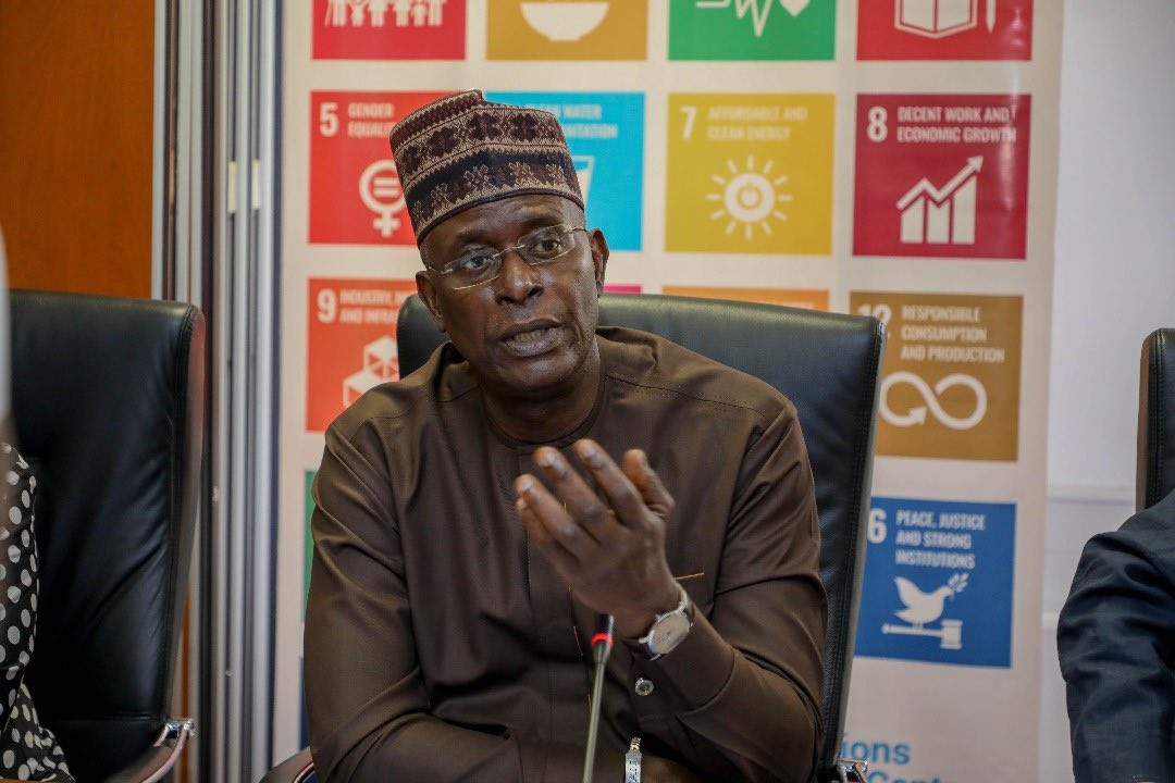 Photo of Mohamed M. Malick Fall with an SDG backdrop