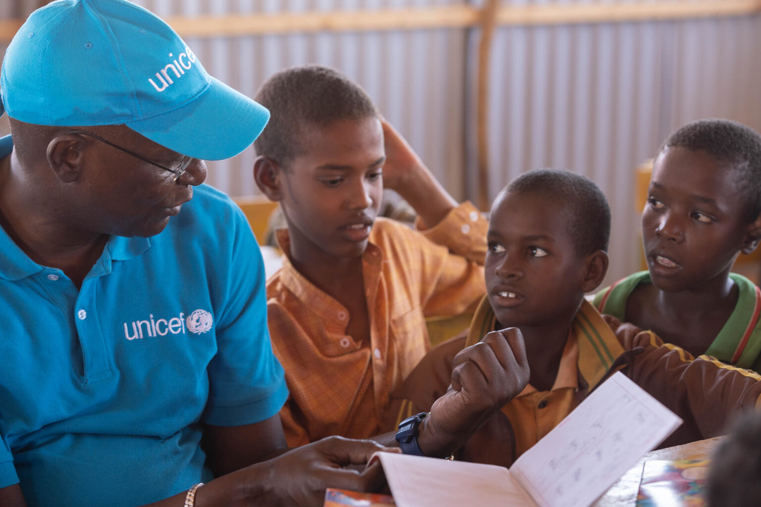 Mohamed M. Malick Fall interacting with children inside a classroom