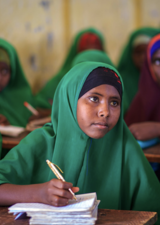 Girl taking notes during class